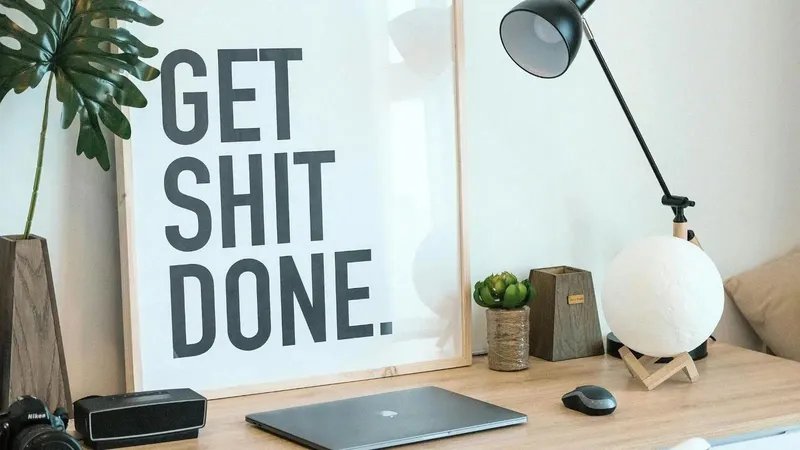 Workspace wth the sign: Get Sh*t Done
