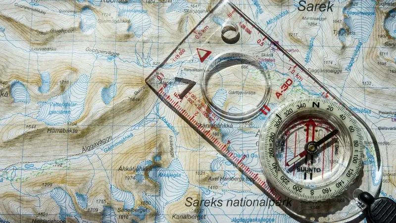 Compass laid over a complex map