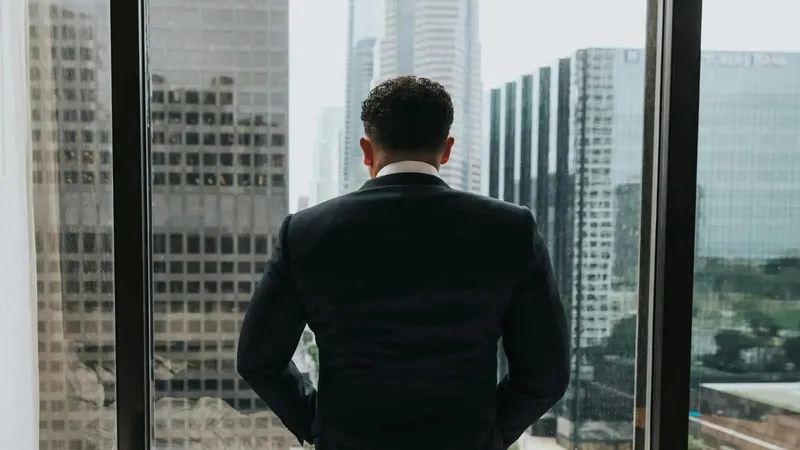 Corporate professional looking out the window