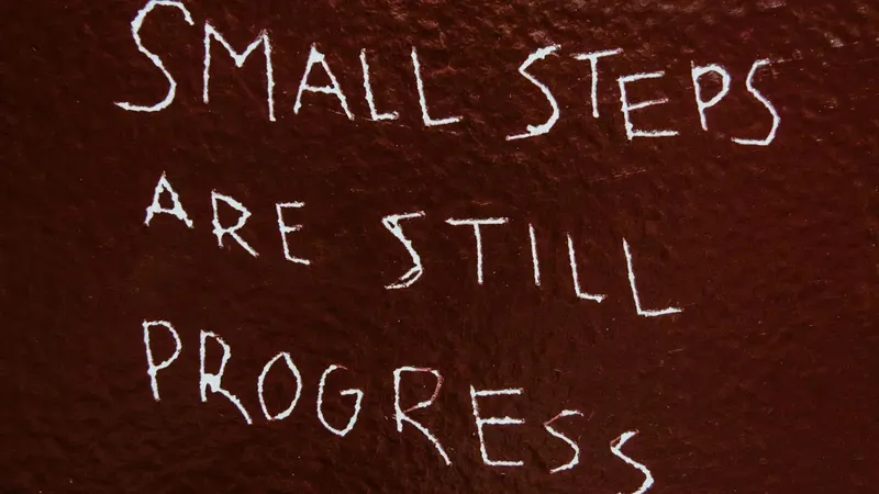 Small Steps Are Still Progress etched into a wall