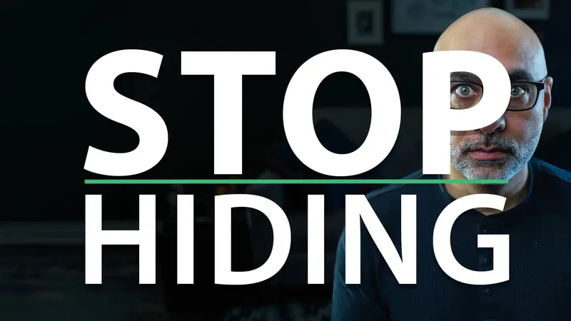 Man hiding behind the text: Stop Hiding